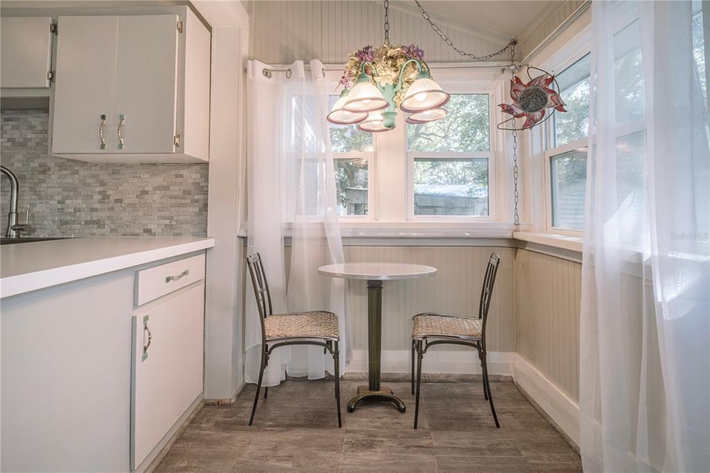510 East Key Avenue Eustis, FL 32726 - Photo 24 of 40 a view of a dining room with furniture window and wooden floor