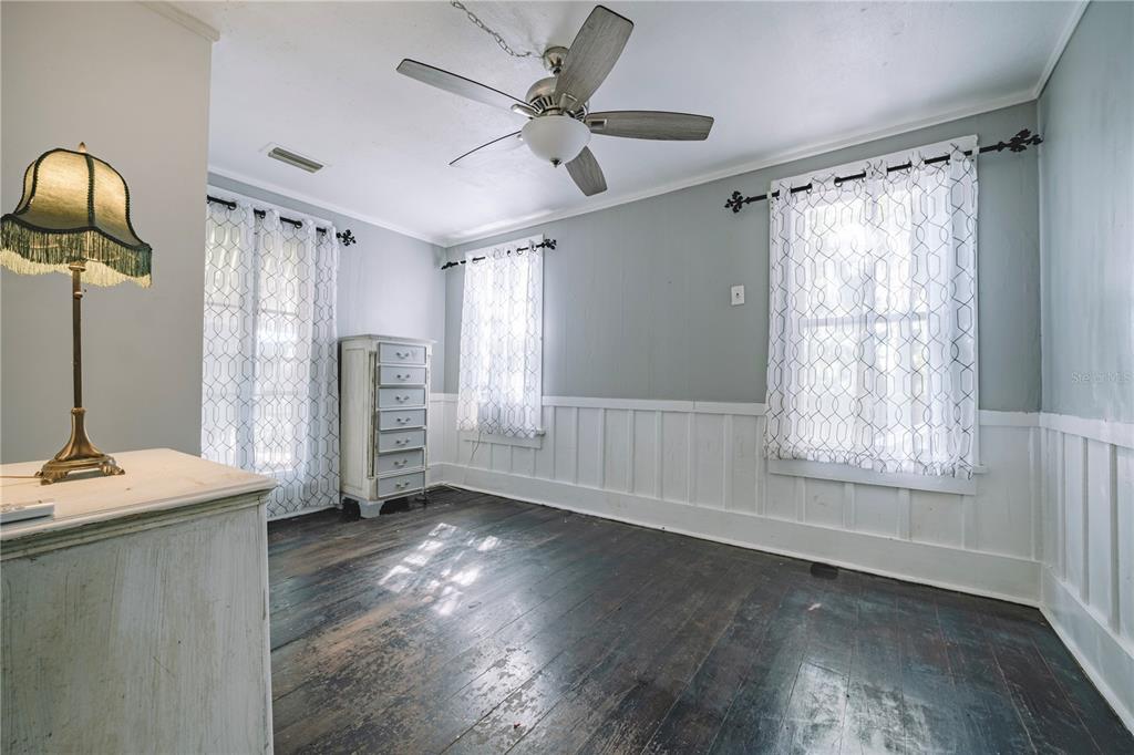 510 East Key Avenue Eustis, FL 32726 - Photo 29 of 40 a view of an empty room with a window and wooden floor