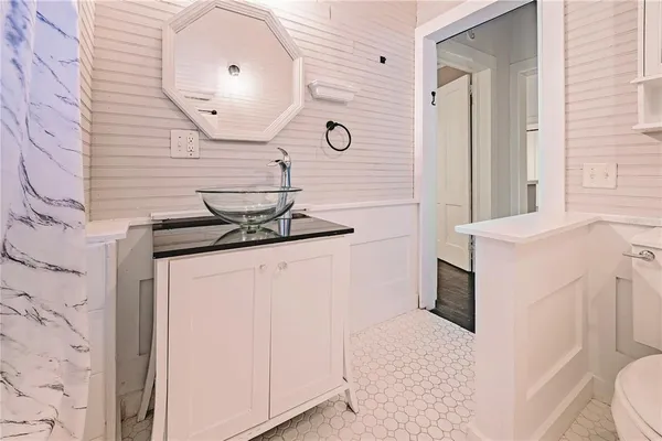 a bathroom with a sink and a mirror