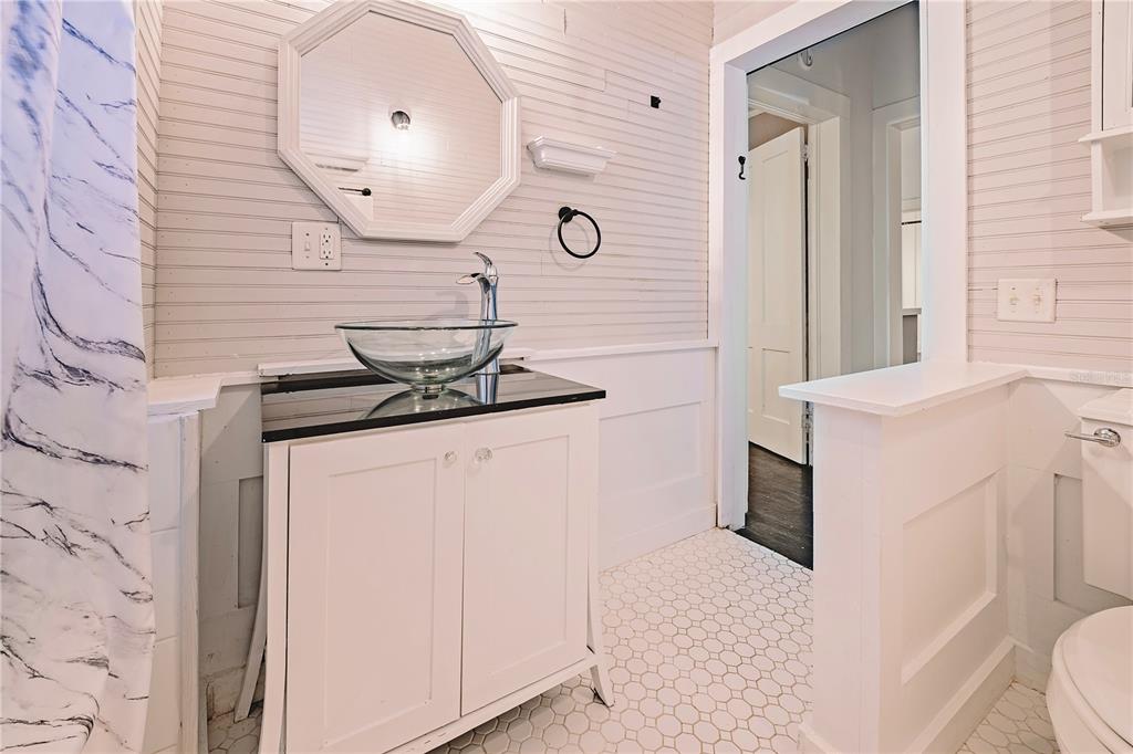 510 East Key Avenue Eustis, FL 32726 - Photo 32 of 40 a bathroom with a sink and a mirror