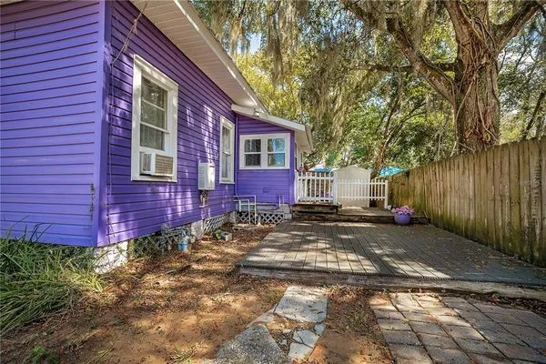 a view of a brick house with a yard