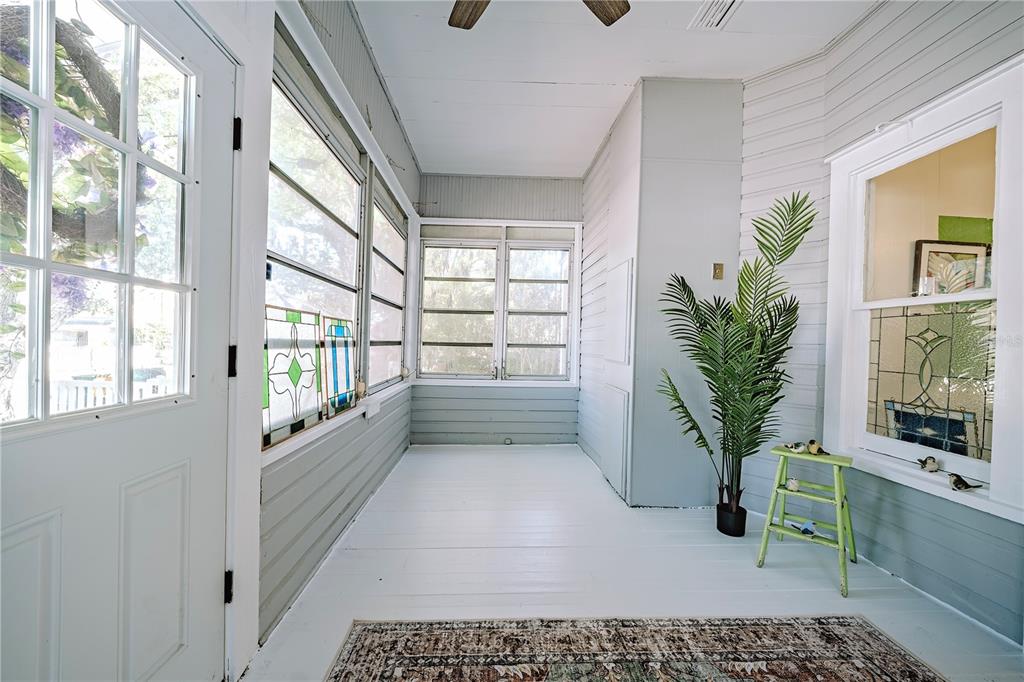 510 East Key Avenue Eustis, FL 32726 - Photo 8 of 40 a room with a potted plant and a large window