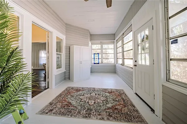 a view of entryway with furniture and a rug
