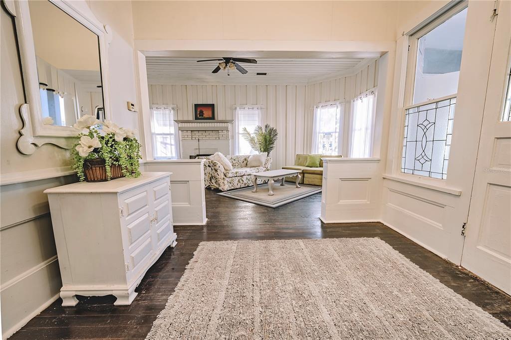 510 East Key Avenue Eustis, FL 32726 - Photo 10 of 40 a living room with fireplace furniture and a large window