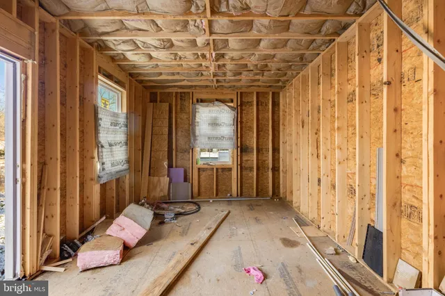 a very nice looking room with a large window and furniture