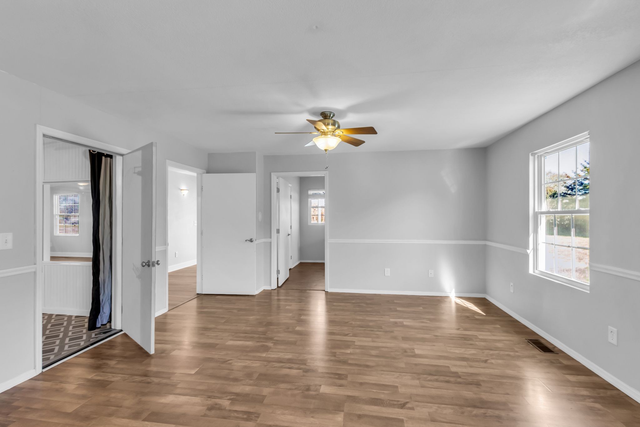 2190 Unionville Deason Road Bell Buckle, TN 37020 - Photo 15 of 33 an empty room with wooden floor and window