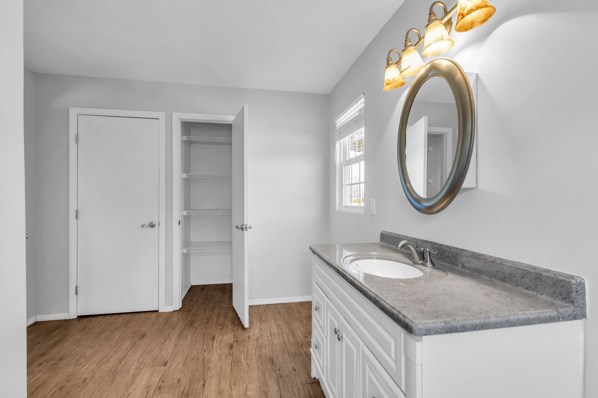 2190 Unionville Deason Road Bell Buckle, TN 37020 - Photo 17 of 33 a bathroom with a granite countertop sink and a mirror