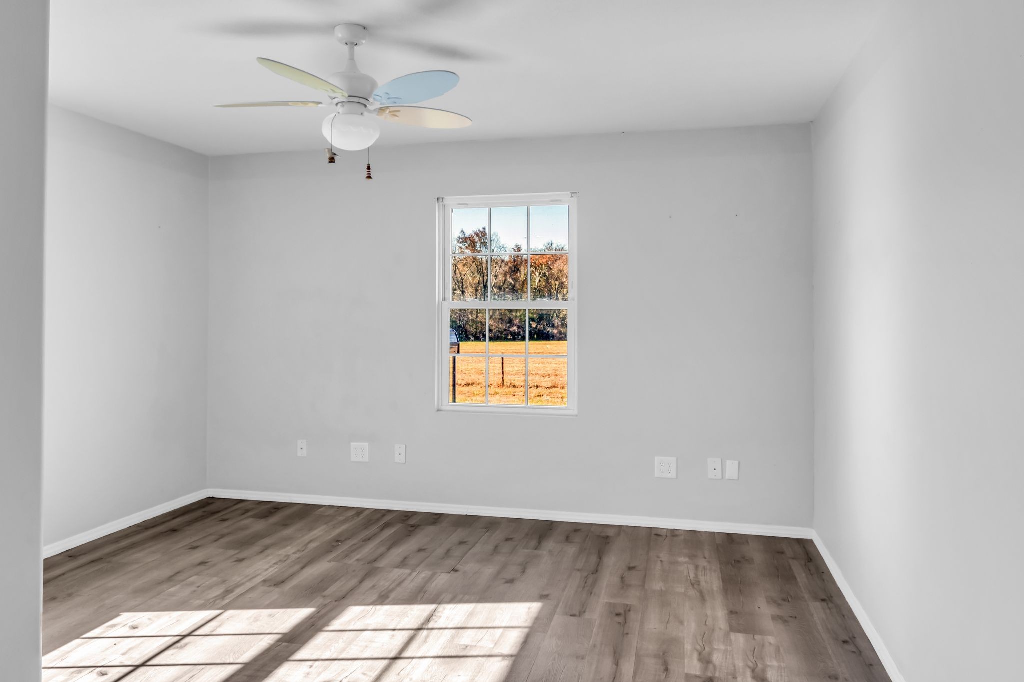 2190 Unionville Deason Road Bell Buckle, TN 37020 - Photo 25 of 33 wooden floor in an empty room with a window