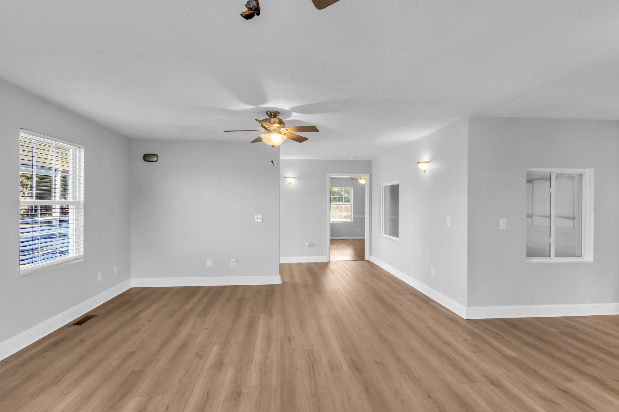 2190 Unionville Deason Road Bell Buckle, TN 37020 - Photo 7 of 33 a view of an empty room with wooden floor and a window