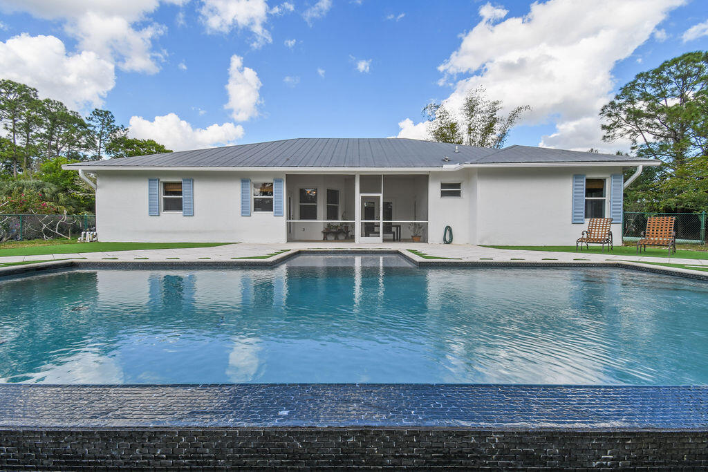 10792 Randolph Siding Road Jupiter, FL 33478 - Photo 20 of 55 a view of a house with a yard