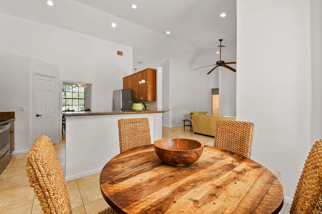 10792 Randolph Siding Road Jupiter, FL 33478 - Photo 36 of 55 a living room with furniture and a flat screen tv