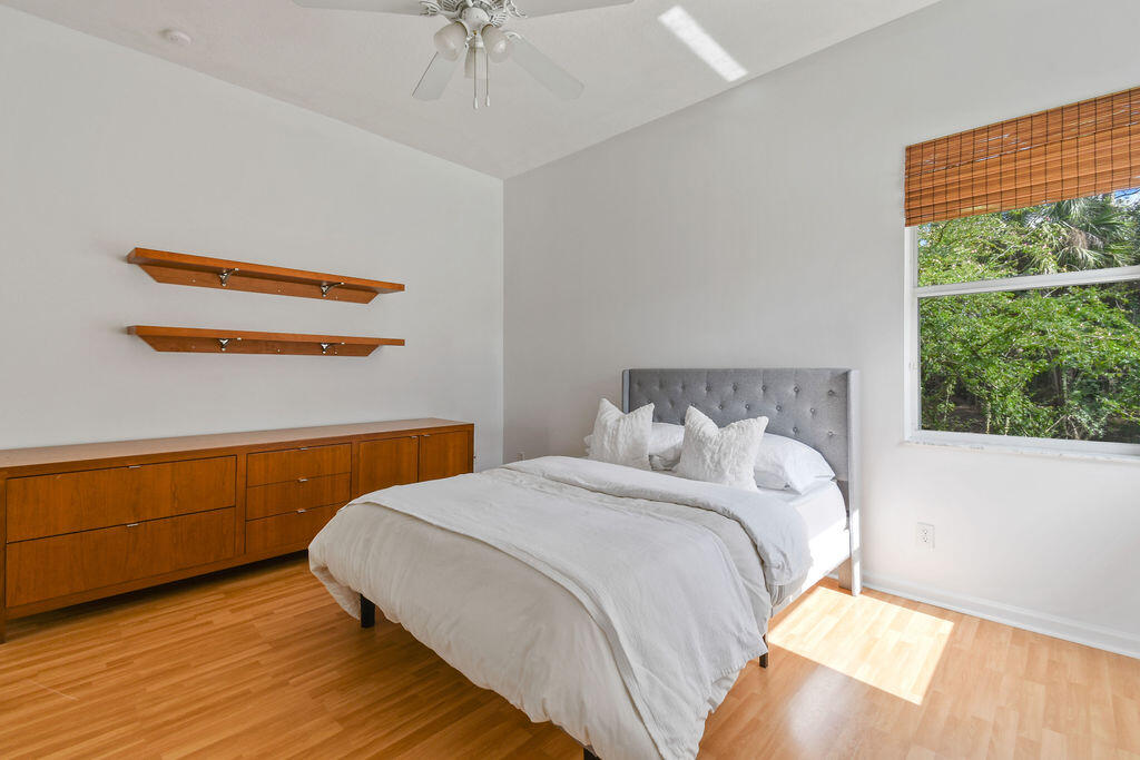 10792 Randolph Siding Road Jupiter, FL 33478 - Photo 47 of 55 a bedroom with a bed and a window