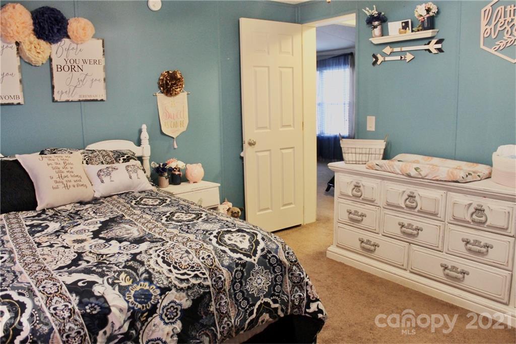 199 Robertson Road Rutherfordton, NC 28139 - Photo 12 of 13 a bedroom with a bed and a dresser