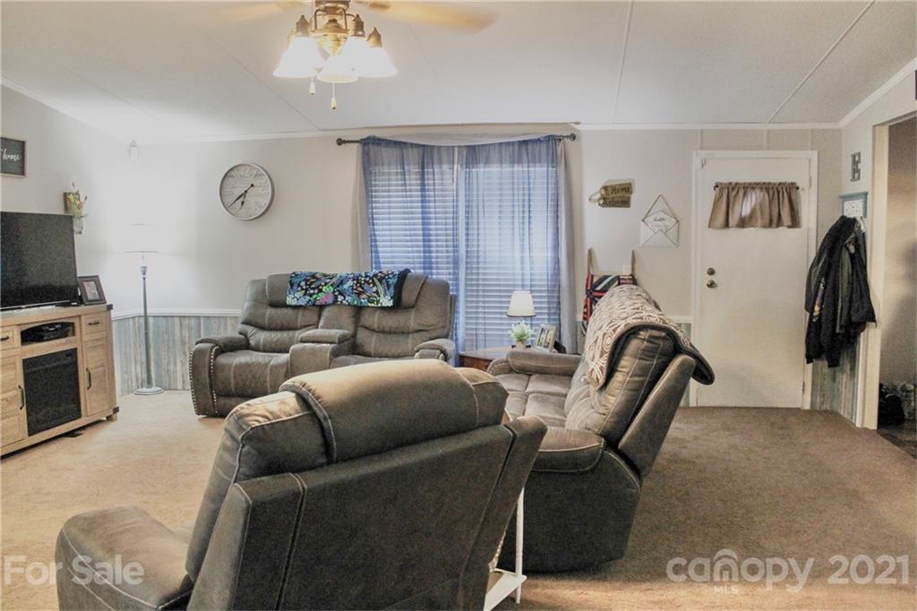 199 Robertson Road Rutherfordton, NC 28139 - Photo 5 of 13 a living room with furniture a couch and a window