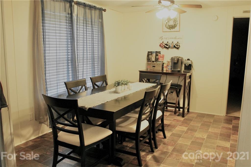 199 Robertson Road Rutherfordton, NC 28139 - Photo 7 of 13 a view of a dining room with furniture and wooden floor