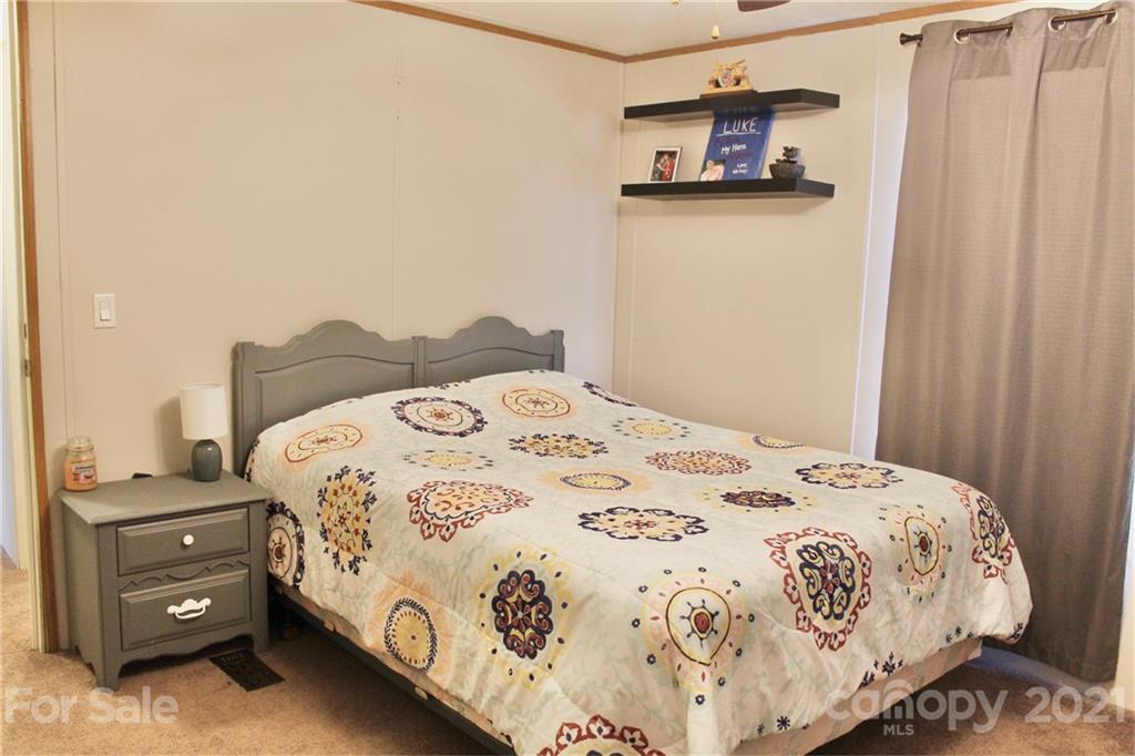 199 Robertson Road Rutherfordton, NC 28139 - Photo 9 of 13 a bedroom with a bed and a window