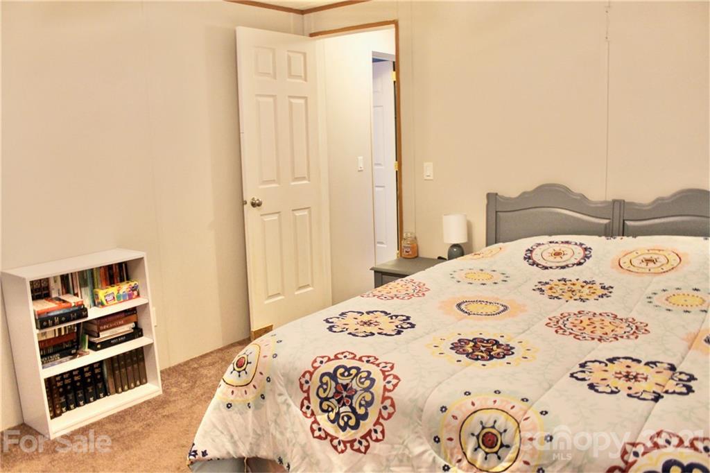 199 Robertson Road Rutherfordton, NC 28139 - Photo 10 of 13 a large bedroom with a bed