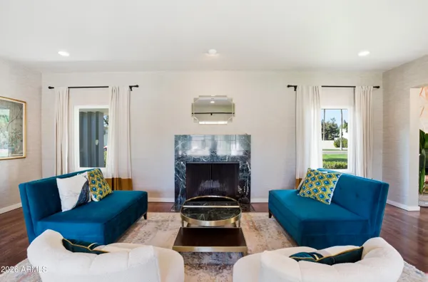 a living room with furniture and a fireplace