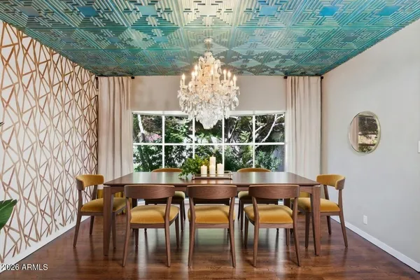 a dining room with furniture and window