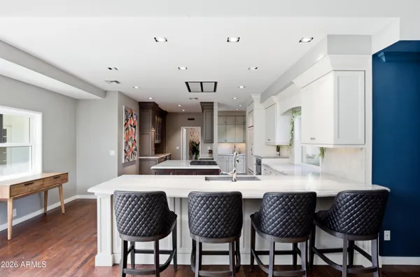 a dining room with furniture and window