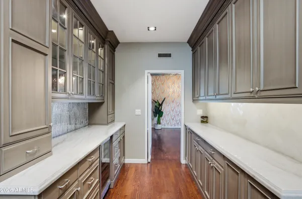 a kitchen with a sink and cabinets