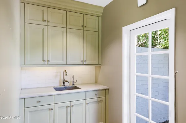 a kitchen with a sink and cabinets