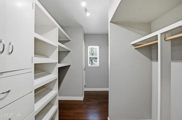 a view of an empty walk in closet