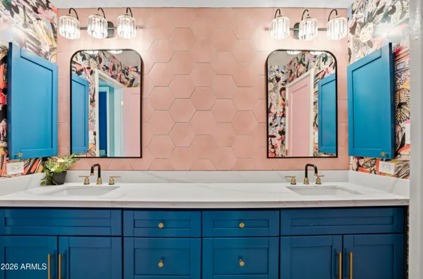 a bathroom with a sink and a mirror