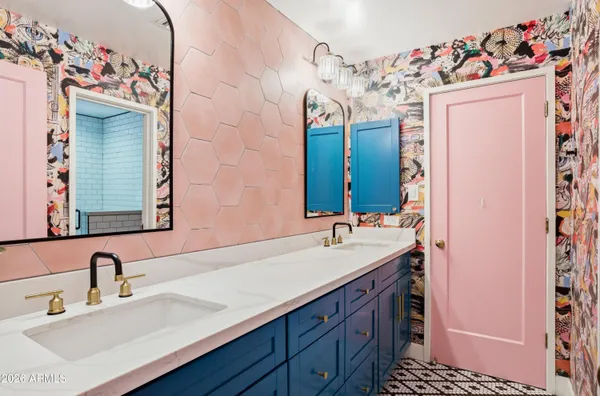 a bathroom with a sink vanity and a mirror