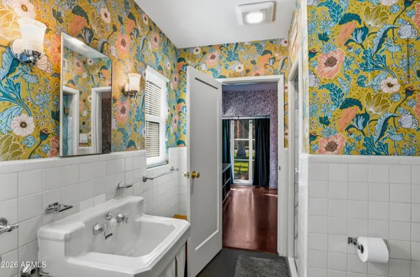a bathroom with a sink and a mirror