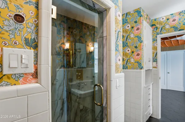 a bathroom with a bathtub and a shower