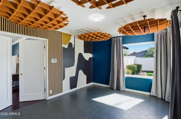 a view of a porch with a table and chairs