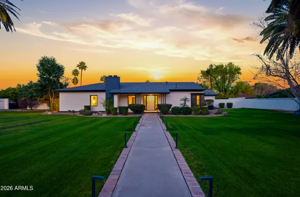 a view of a front of house with a yard