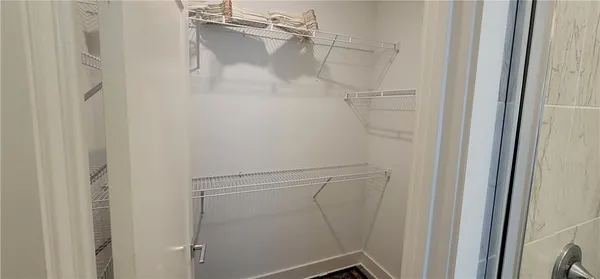 a view of a swimming pool with a yard