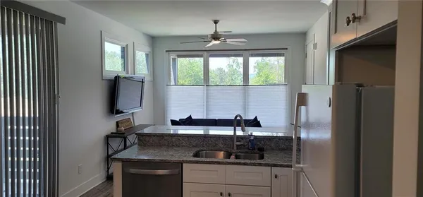 a room with a chair and a window