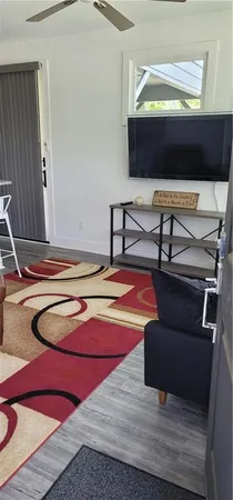 a kitchen with cabinets appliances and a window