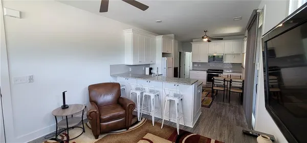 a kitchen with a stove and a refrigerator