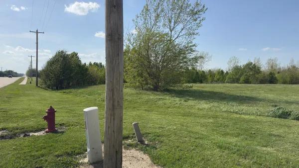 a view of grassy field with trees