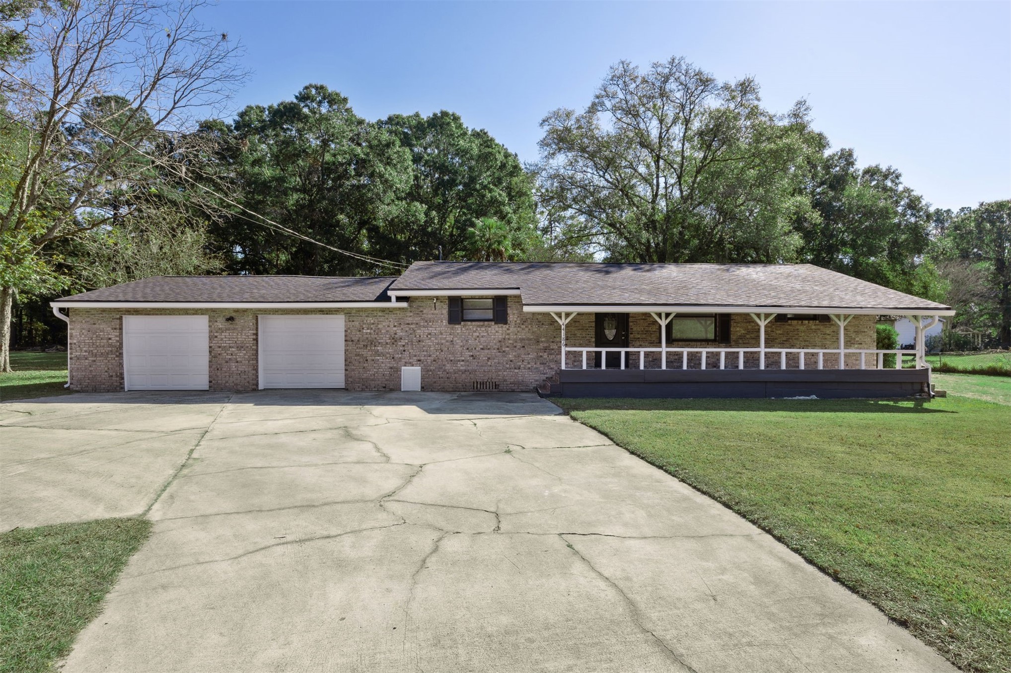 a view of house with outdoor space and swimming pool