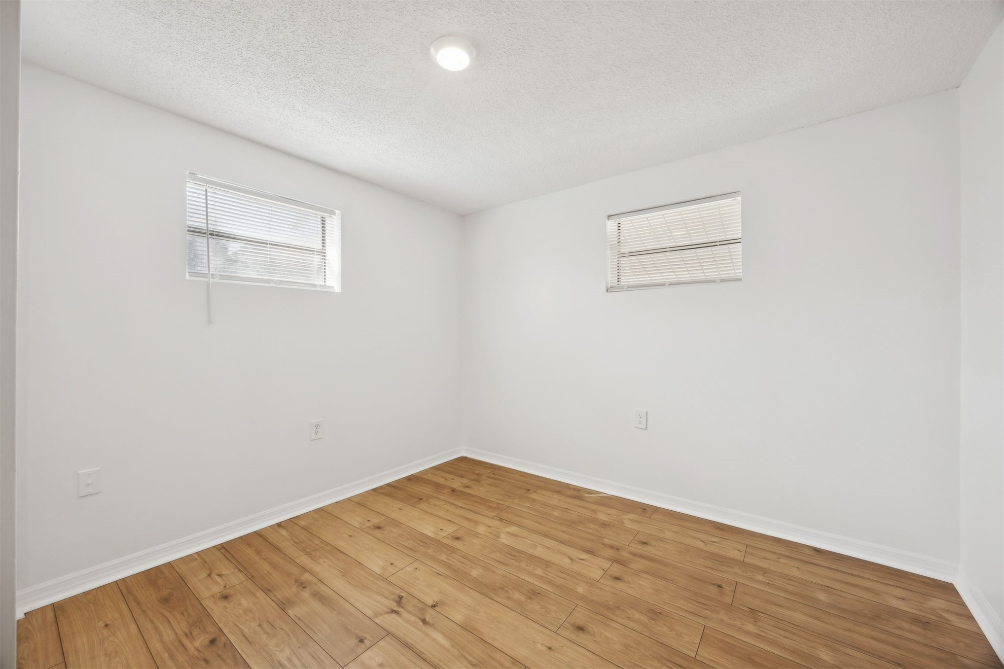 44186 Lee Drive Callahan, FL 32011 - Photo 11 of 29 a view of empty room with wooden floor