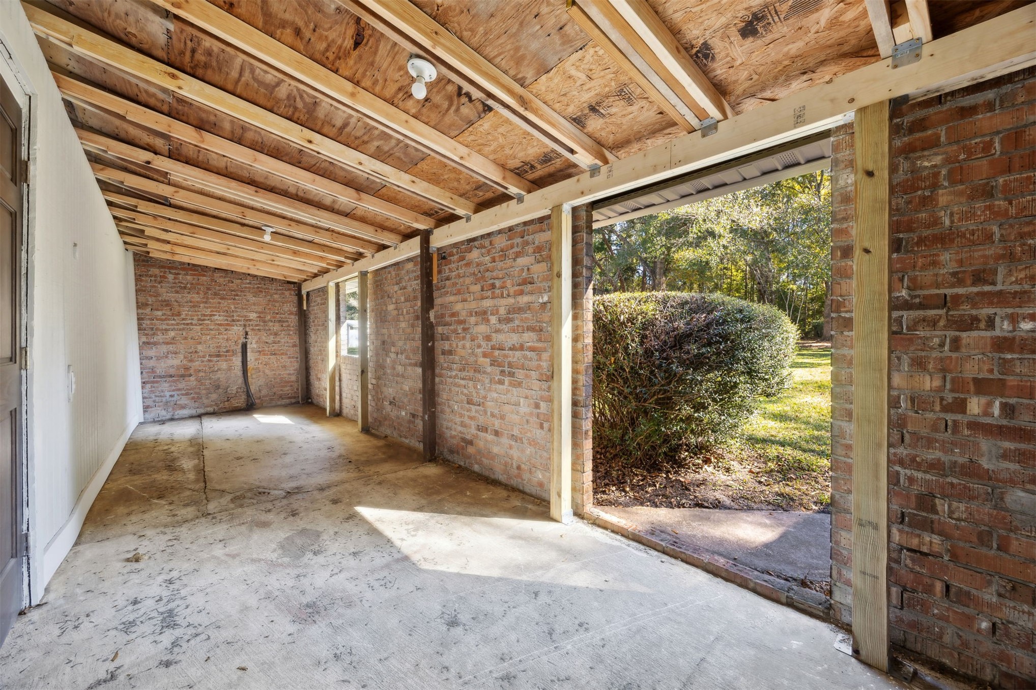 44186 Lee Drive Callahan, FL 32011 - Photo 17 of 29 a view of empty room with wooden floor and floor to ceiling window