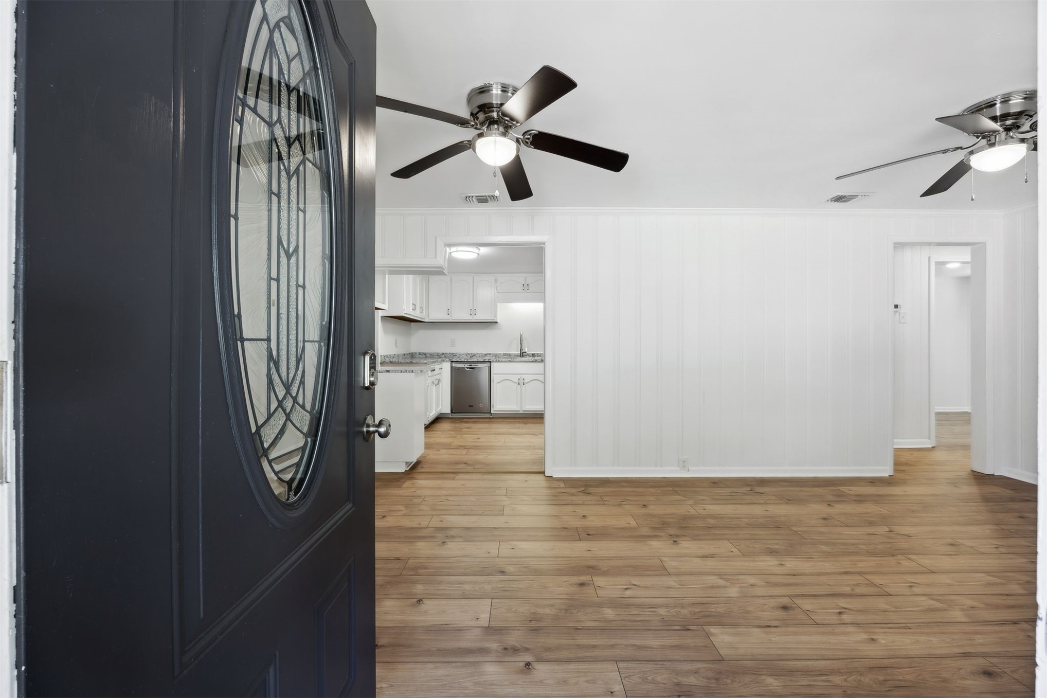 44186 Lee Drive Callahan, FL 32011 - Photo 3 of 29 a view of empty room with wooden floor and fan