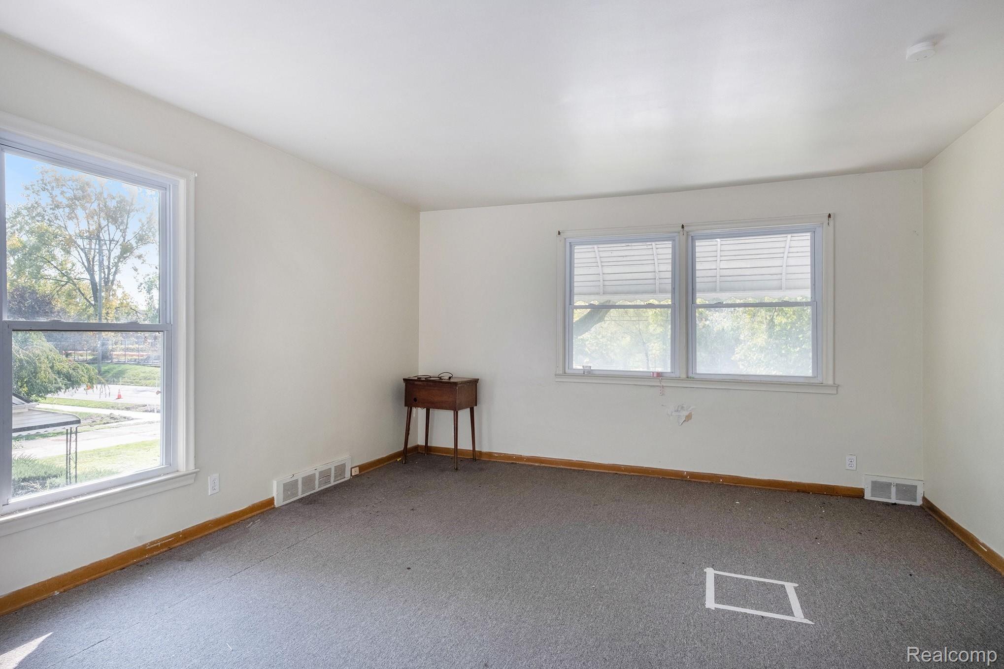 432 Alter Road Detroit, MI 48215 - Photo 16 of 19 Beautifully laid out upper bedroom with large updated windows providing natural light