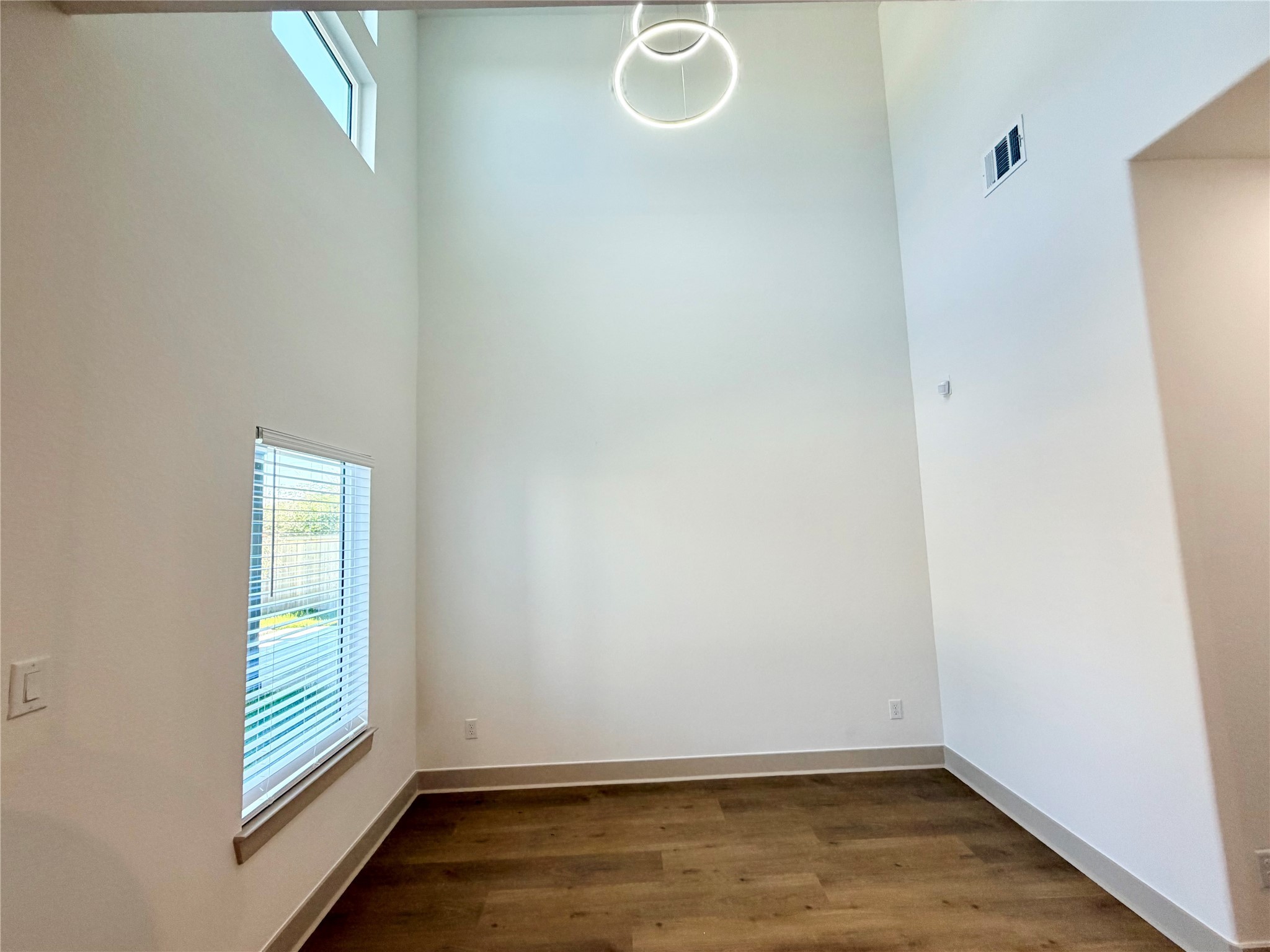 4214 Clover Street Houston, TX 77051 - Photo 11 of 34 a view of room with window and hardwood floor