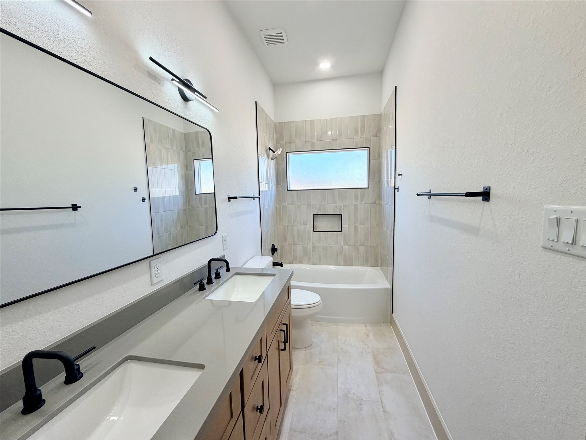 4214 Clover Street Houston, TX 77051 - Photo 17 of 34 a bathroom with a tub sink and mirror