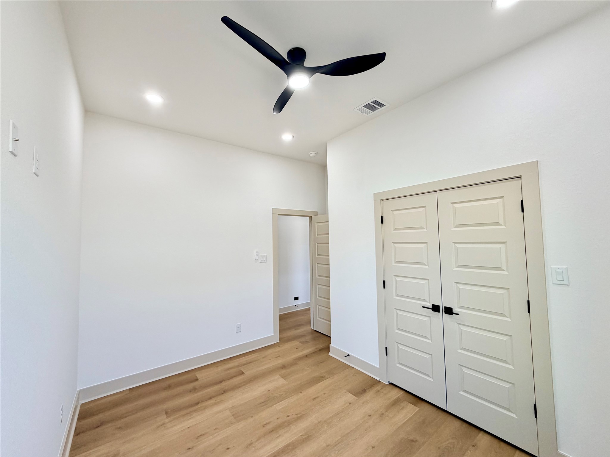 4214 Clover Street Houston, TX 77051 - Photo 22 of 34 an empty room with closet and wooden floor