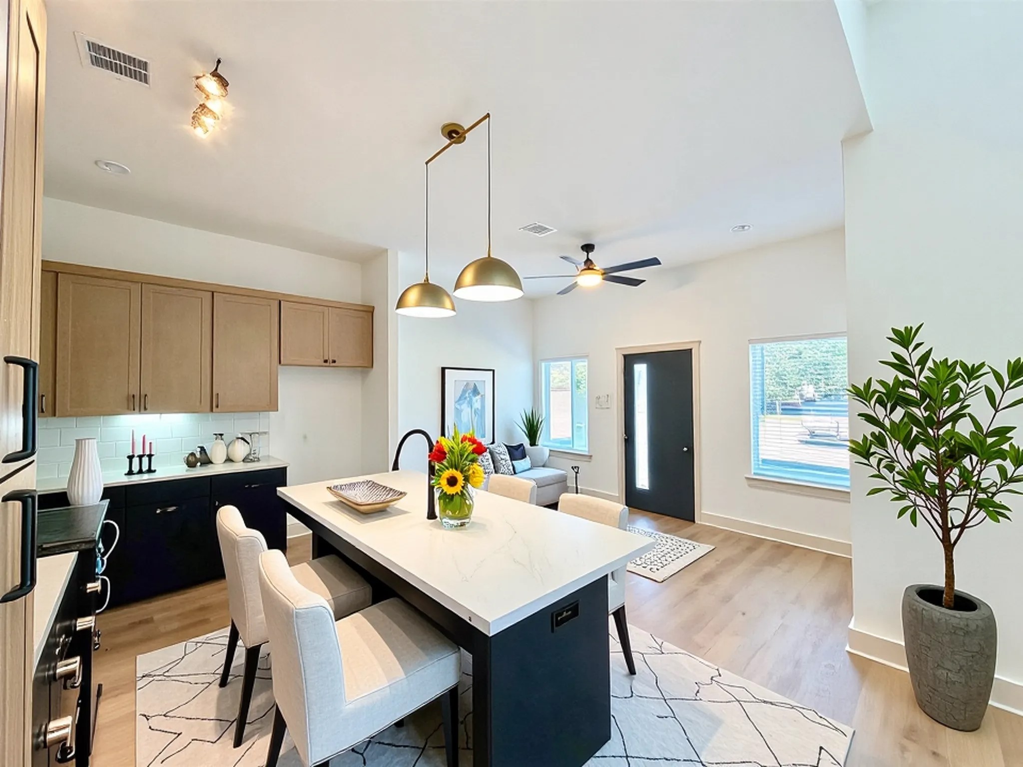 4214 Clover Street Houston, TX 77051 - Photo 6 of 34 a kitchen with a table a sink and cabinets