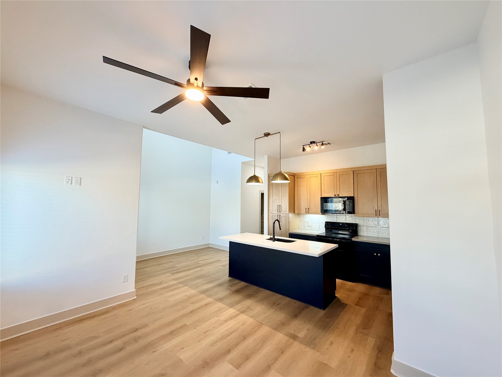 4214 Clover Street Houston, TX 77051 - Photo 7 of 34 a living room with kitchen island granite countertop furniture and a fireplace