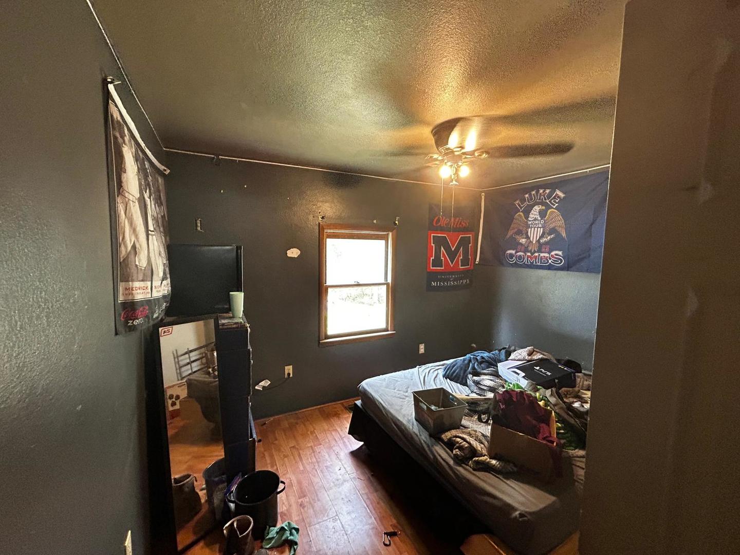 3073 Hotze Road Salem, IL 62881 - Photo 17 of 20 a bedroom with a bed and a chandelier