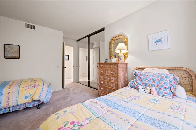 an aerial view of residential houses with outdoor space and ocean view